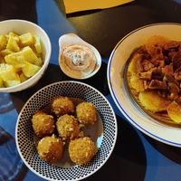 Bravas, croquetas de queso vegano, shitake a la feira at Sa Capca in Blanes