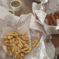 Vegan sausage in batter and chips with curry sauce  at Pie Corner Fish Bar in Newport