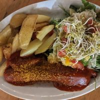 Vegan Curry Sausage with potato wedges and kraut salad (13,50€) - 4/5 at Schleusenkrug in Berlin