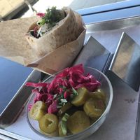 Pickles and falafel pita sandwich at Hasiba in Los Angeles