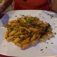 Penne with olives and tomatoes (vegan)   at Ristoro Dantesca in Pisa