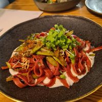 Beetroot pasta in cheese sauce with asparagus and thyme at Orteá - Vegan Collective in Lisbon