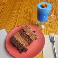Ferreo rocher cake (very rich but delish 4/5) with blue spirulina latte (pretty but not much flavor, 2/5) at Orteá - Vegan Collective in Lisbon