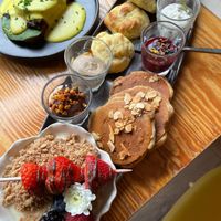 Brunch - Pancakes, yogurt with granola and fruit and several paté, cheeses for the bread at Orteá - Vegan Collective in Lisbon