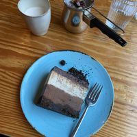 Coconut and chocolate cake, chai latte  at Orteá - Vegan Collective in Lisbon