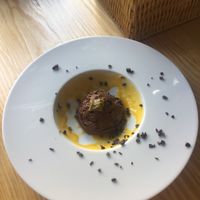 Chocolate mousse speckled in passion fruit and mango at Orteá - Vegan Collective in Lisbon