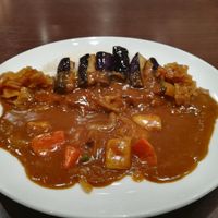 Vegetable and eggplant curry (added pickled Daikon radish on sides) at CoCo Ichibanya - Keihan Shichijo in Kyoto