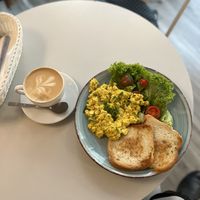 Cappuccino with soy milk and scrambled tofu   at Cakester Cafe in Krakow