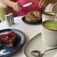 Avo and hummus bagel, matcha with soy milk and cherry and choc cake🙌  at Cakester Cafe in Krakow