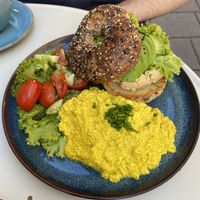 Tofu scramble, and avocado + hummus bagel breakfast-meal deal  at Cakester Cafe in Krakow