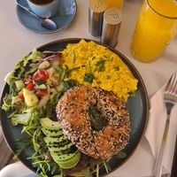 Scrambled tofu and bagel avocado black hummus at Cakester Cafe in Krakow
