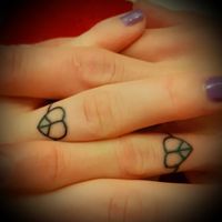Matching civil partnership vegan-ink tattoos at Gun and Pedal Tattoo in Brighton