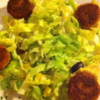 Falafel on chickpea cream and green salad at Veg Point in Tenna