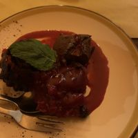 Tortino alla base di cioccolato fondamenterò con salsa di frutti rossi   at Kowalski in Genoa