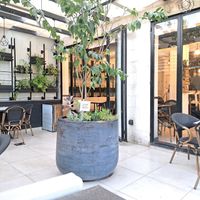 Outdoor and indoor seating at Pepper & Pine Co in Amman