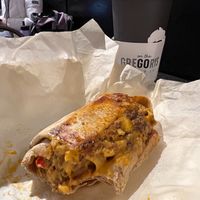 Vegan burrito and medium Fall Oat Boy at Gregory's Coffee - 8th Ave in New York City
