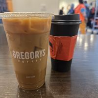 Hall & Oats and an oat milk latte  at Gregory's Coffee - 8th Ave in New York City
