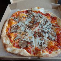 MOD crust, spicy calabrian chili red sauce, v. cheese, and fungo. at Mod Pizza - Mueller Market in Austin