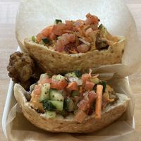 Cauliflower shawarma.  Crispy cauliflower tossed in shawarma spices served in pita bread layered in mixed greens, salata Baladi, and spicy tahini sauce  at POTs - Cloud Kitchen in Las Vegas