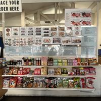 Part of their massive menu and some asian snacks/products  at Ocean Sushi Deli in Monterey