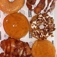 Creme brûlée, OG glazed, apple fritter, blue berry fritter, butter nut at Grumpy Donuts in Camperdown