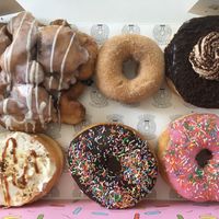 Blueberry fritter, cinnamon, tiramisu, banana, chocolate and strawberry at Grumpy Donuts in Camperdown