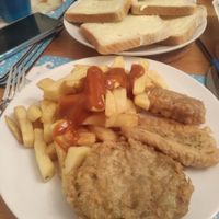 Shared portions of chips, tofu, sausage and mushy pea bombs at Capplemans Fish and Chips in Scarborough