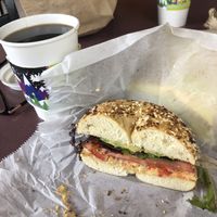 Moats sandwich on everything bagel with black coffee  at Bagels Plus in Conway