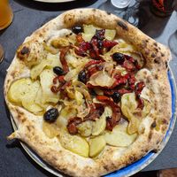 Veganima with potato, red peppers, onions and olives at Timilia in Palermo
