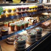 Display of salads, smoothie bowls and puddings (rice pudding, chia seed pudding, oat meal etc). at Dean & David - Hauptbahnhof Express in Berlin