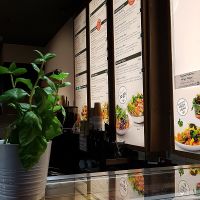 German menu above the counter at Dean & David - Hauptbahnhof Express in Berlin