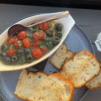 Roasted olives and tomatoes appetizer Aug 2024  at Lido Waterfront Bistro in Victoria