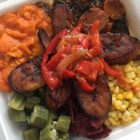 Yummy Goodness!!  - clockwise: Lima beans, brown stew, corn, Rasta pasta, okra, plantains with stewed peppers on top at Shandal's Vegetarian Cafe in Bridgeport
