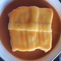 Cheesy goodness with vegetables and sausage inside at Spacos in Vila Praia De Ancora