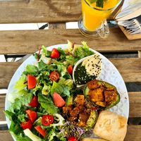 Just great.. baked avocado, hummus, warm rolls and a tasty salad with dressing 🥑🌱😊👍 at co Jak co in Poznan