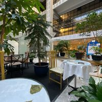 They’ve filled an area of the lobby outside of the glazed space with plants to make a series of peaceful seating areas at Peace-Garden in Ottawa