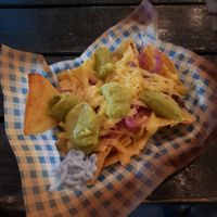 Nachos with vegan cheese, guac and red onions at Vausages in Lichfield
