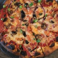 Vegan mozzarella pizza is super tasty.   at The Pint House in Yuma