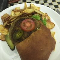 The vegetable burger....some people love it but was too salty for me. Loved the chips though. at NUGA Rosmead in Colombo