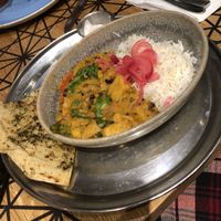 Vegan curry with flatbread and coconut yoghurt. at LGW - Giraffe - ST in Horley