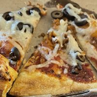 Mega dough crust with red sausage, plant based sausage & black olives.     at Mod Pizza in Greenfield