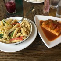 Veganized Rasta Pasta in a creamy spicy coconut sauce with a side of tofu in a delicious sauce. at 11 Hauz in Park City