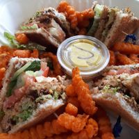 Vegan Club house with sweet potato fries to go. They have much more at M&Js Eatery in Bedford