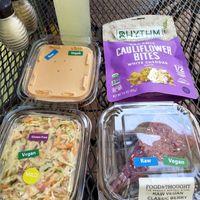 Vegan nut cheese, Costa Rica coleslaw, raw berry cheesecake, and cauliflower bites in vegan white cheddar flavor at Food and Thought in Naples