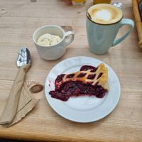 Warm cherry pie with vegan ice cream and oat latte at Apple Store Cafe in Scorton