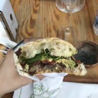 Vegan Sandwich with arugula, avocado, tomato and olives paste at NaturalMente in Varenna