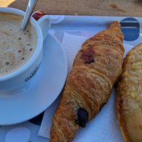Café con avena, croissant de chocolate y pepito (buenísimo) at Pasteleria Serra in Gandia