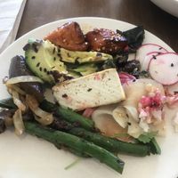 A mixture of vegan poke and veggie side dishes  at Flower Child in Boulder