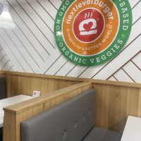Booth Seating Area and Signage  at Next Level Burger - Potrero Hill in San Francisco