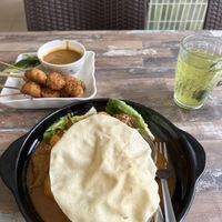 Curry mutton rice and satay sticks with green tea  at Cameleon Vegetarian Bean Curd in Kuala Lumpur